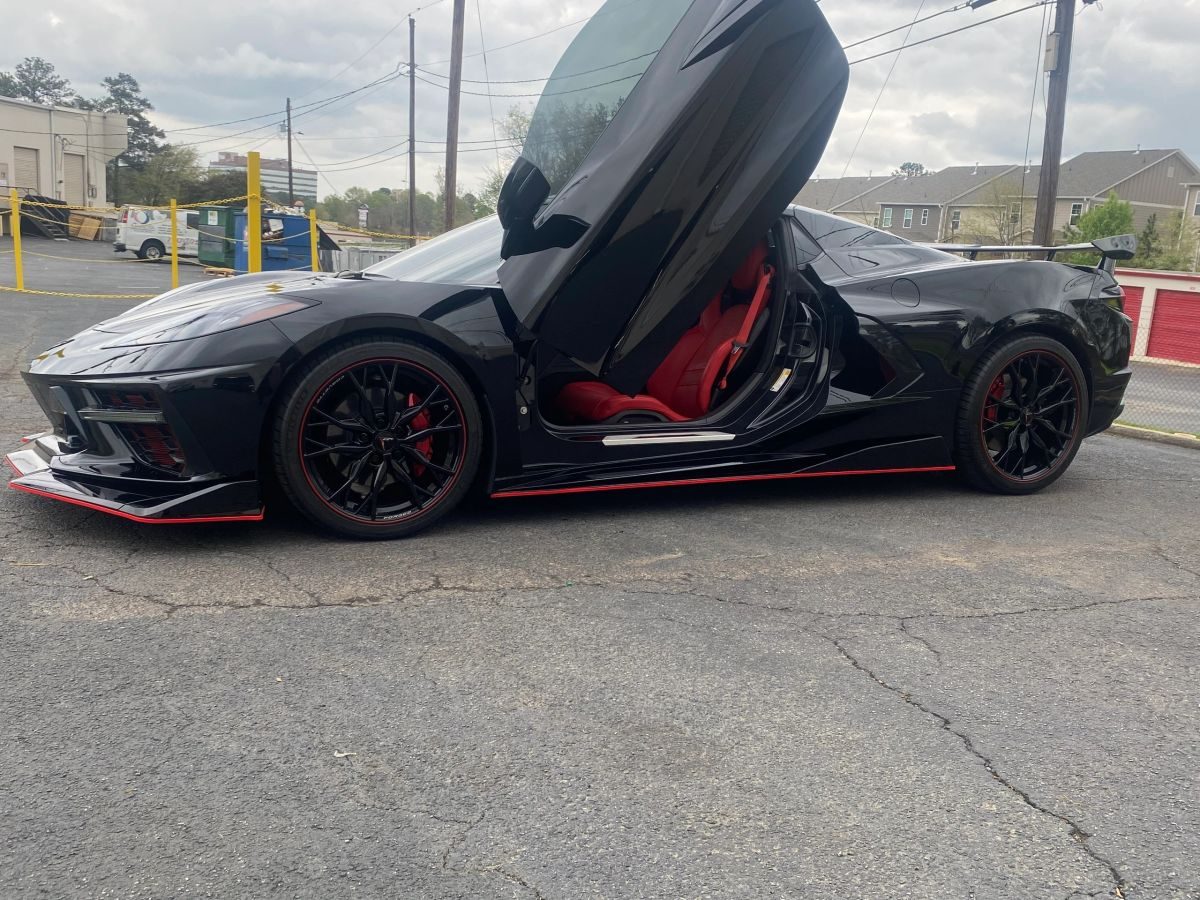 Exotic coupe with doors up after service