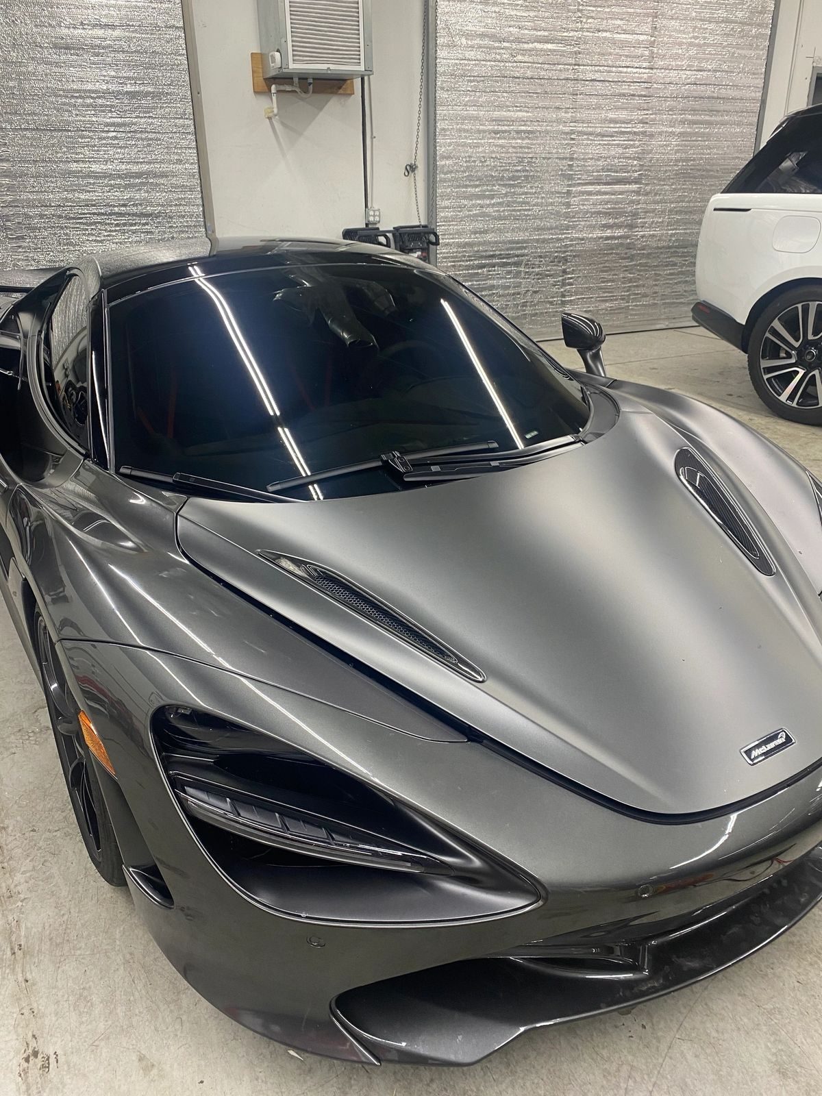 Grey McLaren 720S with ceramic coating in the Project-X shop