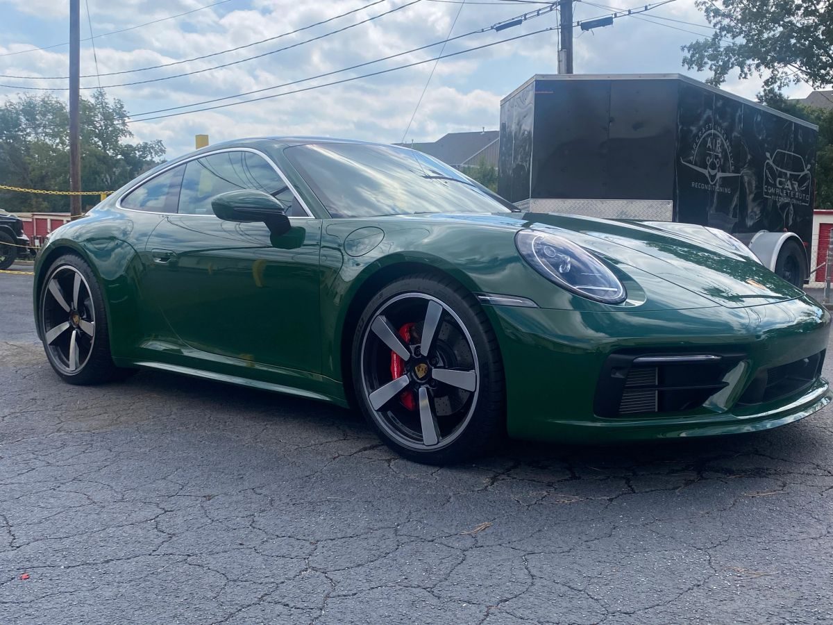 Green Porsche 911 after protection service